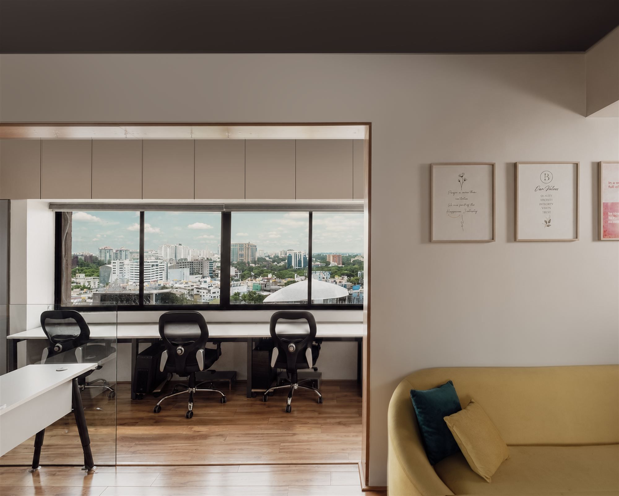 Open workspace with mustard lounge seating and framed value statements